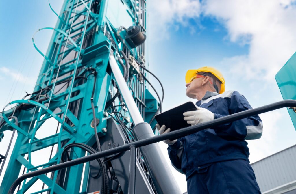 A technician inspects a drilling rig to maintain its efficiency.